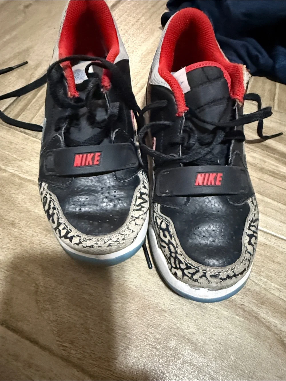 Nike Kids Black Sneakers with Red Lining and Blue Swoosh